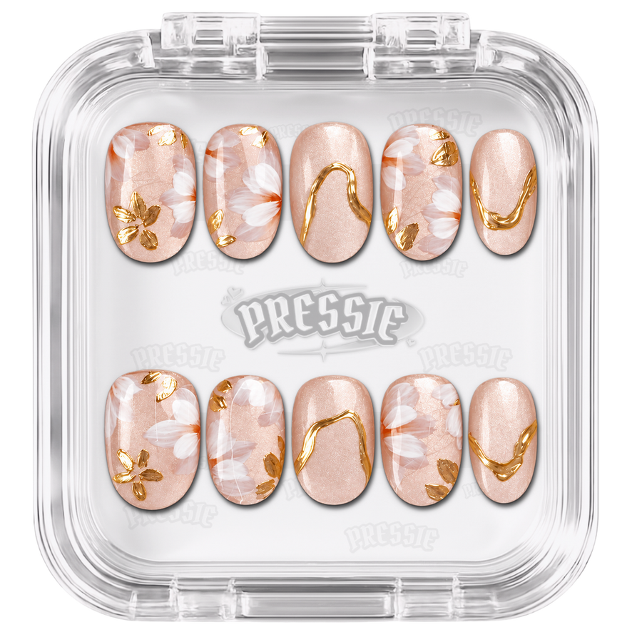 Faux ongles nude et blancs à motifs dorés, présentés dans leur boîte Pressie Nails — Diana. @product