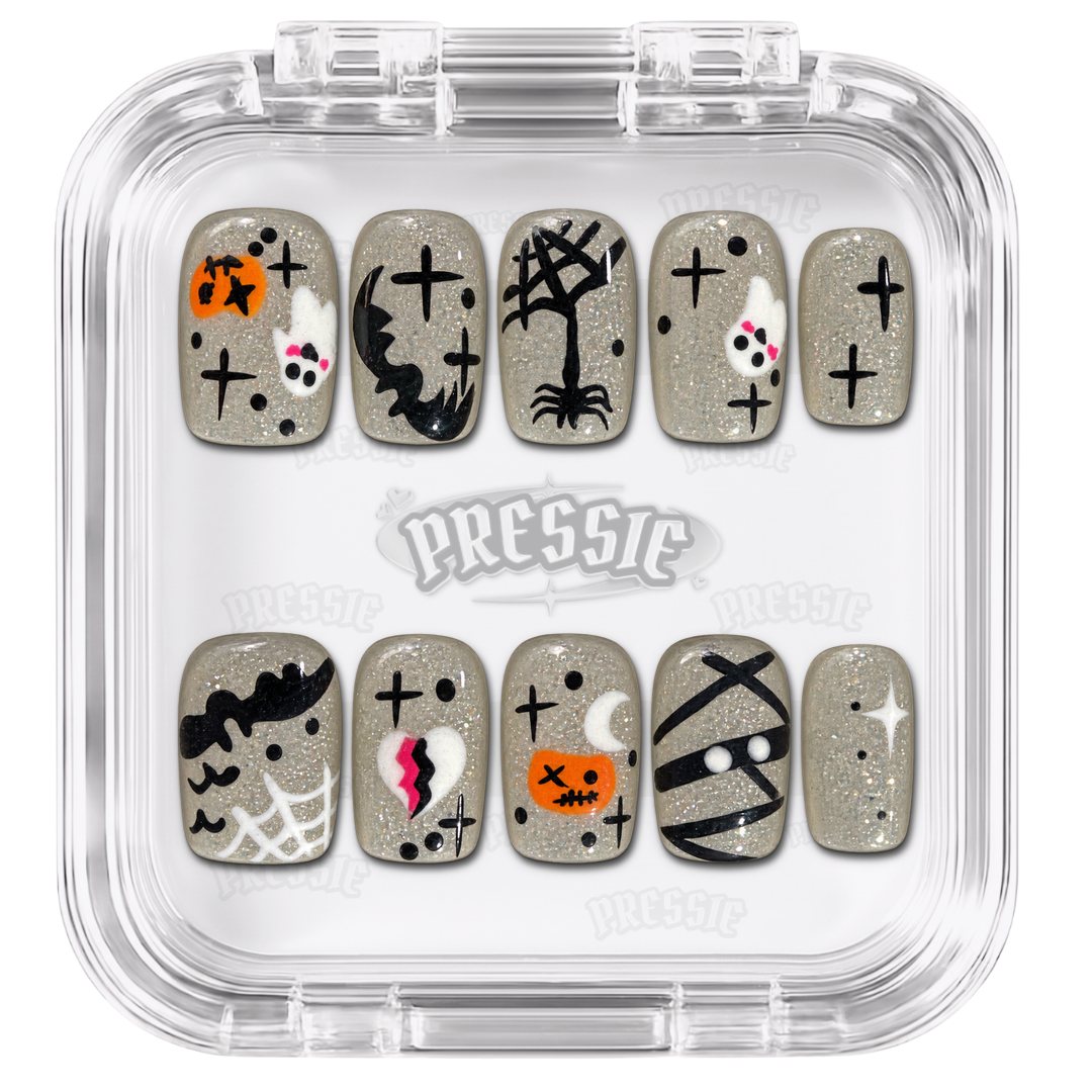 Faux ongles nude et noirs à motifs de fantômes et croix, présentés dans leur boîte Pressie Nails — Hobag. @product